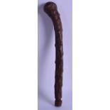 AN ANTIQUE CARVED TRIBAL HARDWOOD CLUB of knobbled form. 42 cm long.