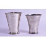 TWO 18TH CENTURY CONTINENTAL SILVER BEAKRS engraved with foliage. 5 oz. 9 cm & 8 cm high. (2)