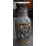 A LARGE CHINESE FAMILLE ROSE TWIN HANDLED CANTON VASE 20th Century, painted with figures within