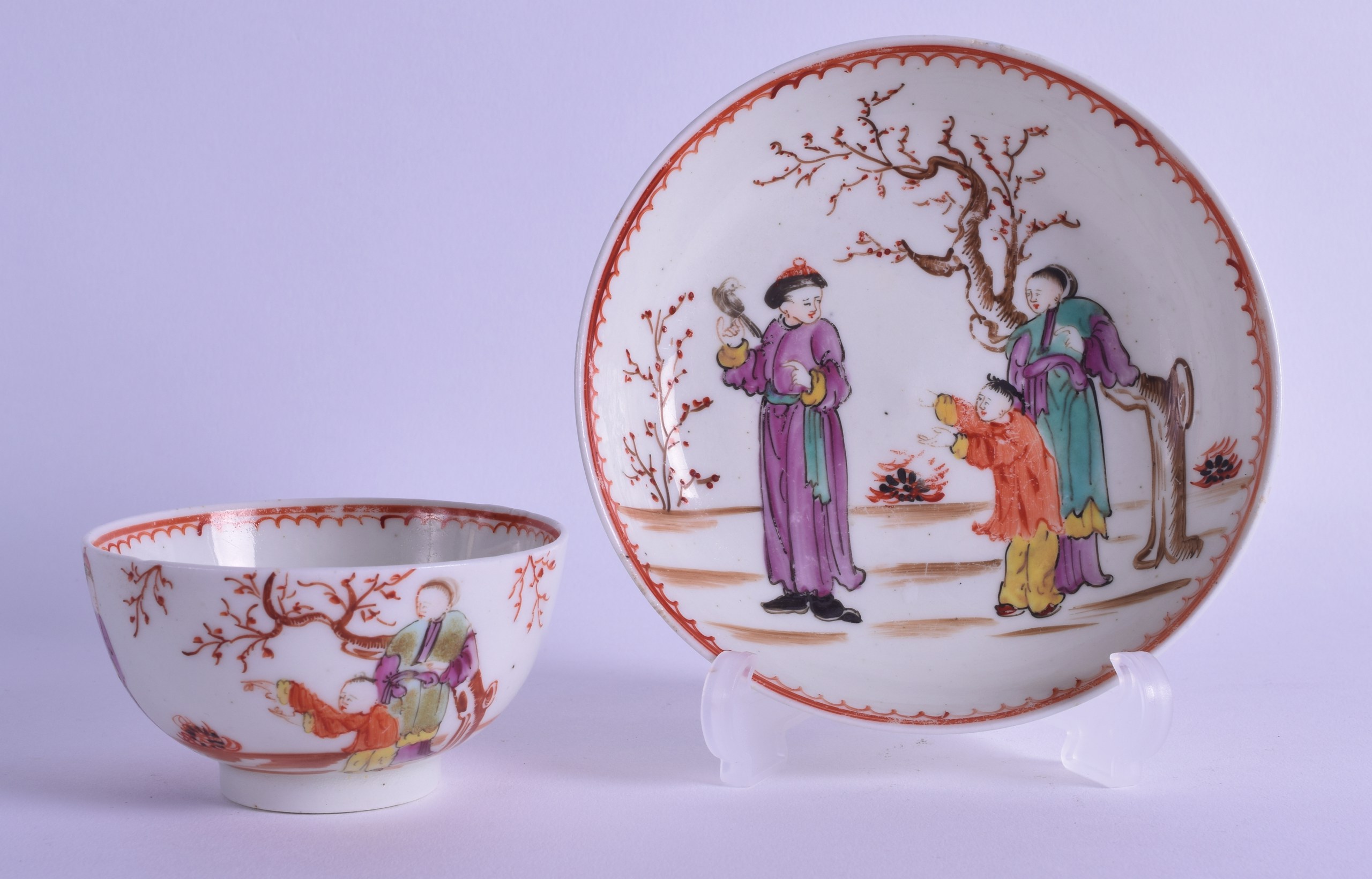 18th c. Lowestoft teabowl and saucer painted with an oriental garden with three Chinese figures