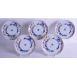 A SET OF FIVE 18TH CENTURY JAPANESE EDO PERIOD IMARI PLATES painted with flowers and underglaze blue