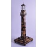 A GOOD AGATE AND WHITE METAL MOUNTED MODEL OF A LIGHTHOUSE the hexagonal top with canted cupola