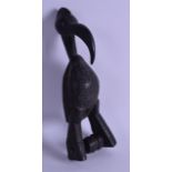 AN UNUSUAL AFRICAN CARVED HARDWOOD TRIBAL PULLEY in the form of a stylised bird. 22 cm high.