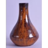 A STUDIO POTTERY BROWN AND YELLOW GLAZED VASE. 11.5 cm high.