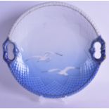 A BING & GRONDAHL COPENHAGEN PORCELAIN DISH decorated with two birds in flight. 26.5 cm diameter.