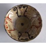 A Small Persian Nishapur Bowl, 9th/10th Century, painted with motifs. 5.5ins diameter.