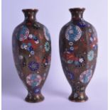 AN UNUSUAL PAIR OF 19TH CENTURY JAPANESE MEIJI PERIOD CLOISONNE ENAMEL VASES decorated with stylised