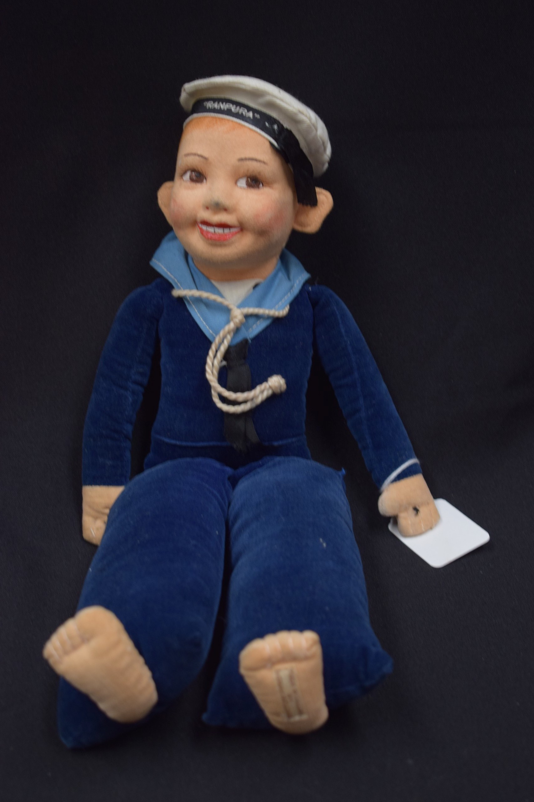 A 1930~2 NORAH WELLINGS DOLL, formed as a sailor boy. 36 cm long.