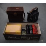 A VINTAGE PROJECTOR with original case, together with various cartridges. (qty)