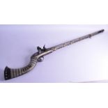 A 19TH CENTURY TURKISH OTTOMAN HUNTING RIFLE inlaid in mother of pearl with extensive motifs. 124 cm