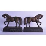 A RARE PAIR OF 19TH CENTURY COLD PAINTED IRON DOOR STOPS in the form of a standing horses upon