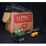 A VINTAGE HORNBY TIN PLATE TOY TRAIN, together with a a large quantity of track.