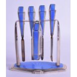 A GEORGE V ART DECO SILVER MANICURE SET ON STAND by Adie Brothers Ltd. Birmingham 1937. 13.5 cm