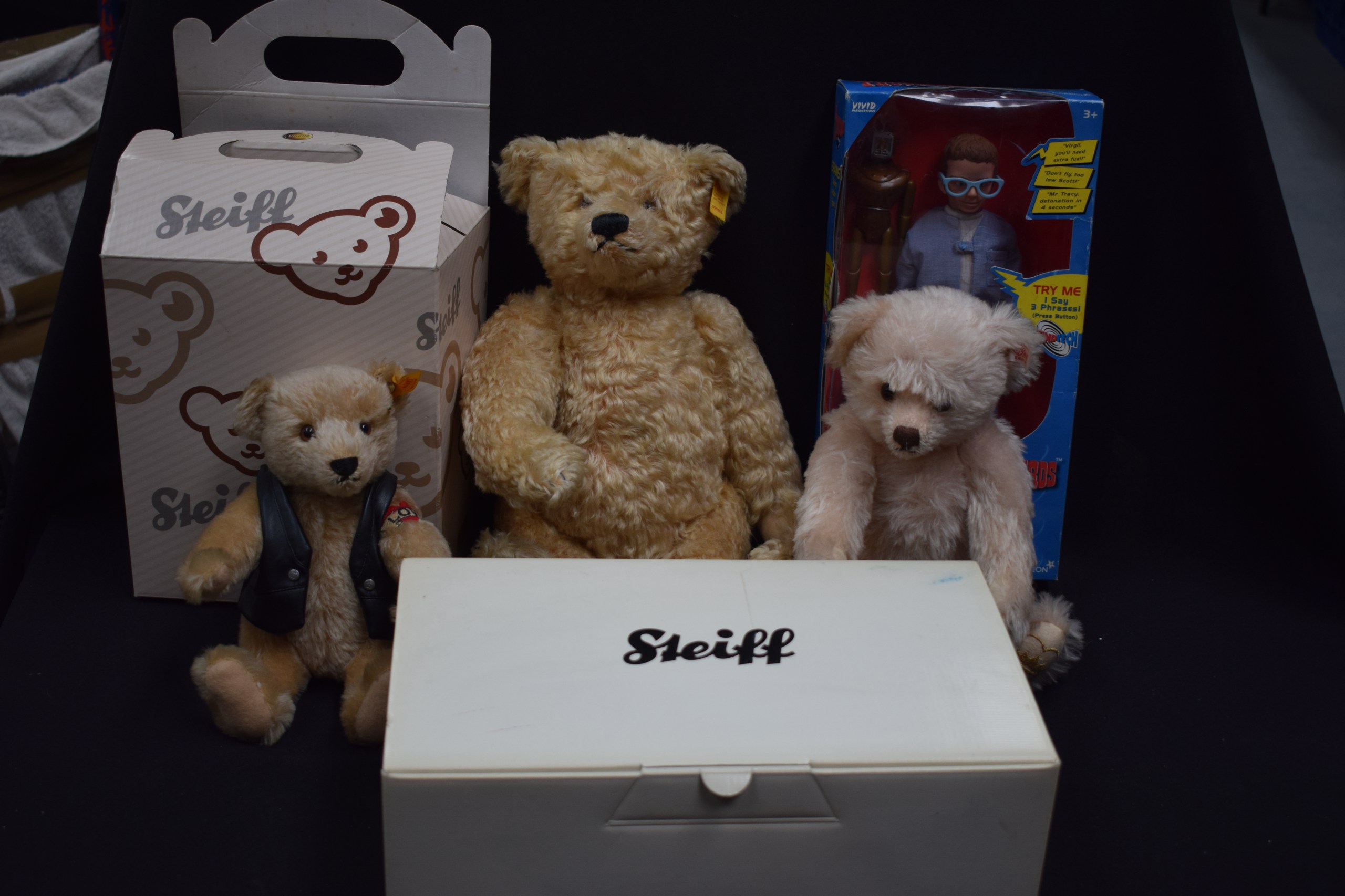 A SMALL GROUP OF STEIFF STUFFED BEARS, together with a thunderbird figure of Brains. (qty)