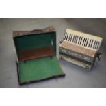 A VINTAGE ITALIAN ACCORDIAN BY PANCOTTI, in original case. 50 cm wide.