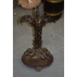 A RARE VICTORIAN COLD PAINTED IRON STICK STAND, formed as a bird standing over a floundered fish. 54