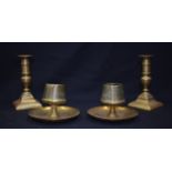 TWO PAIR OF ANTIQUE BRASS CANDLESTICK HOLDERS, of different styles. (4)