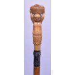 A LATE 19TH CENTURY IVORY HANDLED SWAGGER STICK modelled as a female holding aloft a basket. 60 cm