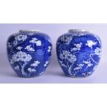 A PAIR OF 19TH CENTURY CHINESE BLUE AND WHITE GINGERS JARS Kangxi style, painted with flowering