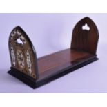 A MID VICTORIAN IVORY ENGRAVED BRASS AND WALNUT SLIDING BOOK RACK with engraved floral mounts. 38 cm