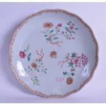AN EARLY 18TH CENTURY CHINESE EXPORT SCALLOPED DISH Yongzheng, painted with floral sprays. 25 cm