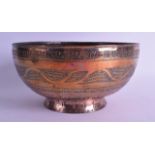 A Persian mixed metal copper bowl, 15th/16th Century, engraved with flowers and motifs. 23.5 cm