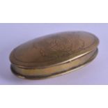 AN 18TH CENTURY DUTCH OVAL BRASS SNUFF BOX depicting a crest of a seated male. 13 cm wide.