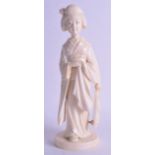 A GOOD LARGE 19TH CENTURY JAPANESE MEIJI PERIOD CARVED IVORY OKIMONO modelled as a standing geisha