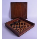 AN ANTIQUE TRAVELLING MINIATURE CHESS SET within a mahogany box. 26 cm x 26 cm.