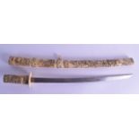 A 19TH CENTURY JAPANESE MEIJI PERIOD CARVED BONE SWORD decorated all over with figures in various