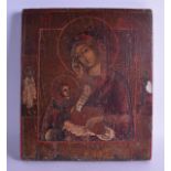 AN EARLY RUSSIAN POLYCHROMED WOODEN ICON depicting a Saint and young child within an interior. 27 cm