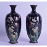 A PAIR OF EARLY 20TH CENTURY JAPANESE MEIJI PERIOD CLOISONNE ENAMEL VASES decorated with extensive