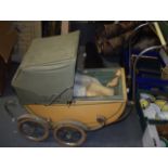 A VINTAGE CHILD~S DOLL PRAM. 80 cm long.