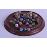 A GOOD SET OF ANTIQUE SOLITAIRE MARBLES. (qty)