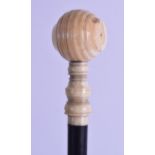 A MID 19TH CENTURY CARVED LONG HANDLED IVORY HAMMER with ebonised shaft. 40 cm long.