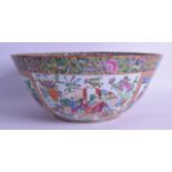 A LARGE 19TH CENTURY CHINESE CANTON FAMILLE ROSE BOWL painted with figures, birds, flowers and