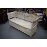 A LARGE PINE BENCH, painted white with seated storage. 172 cm wide