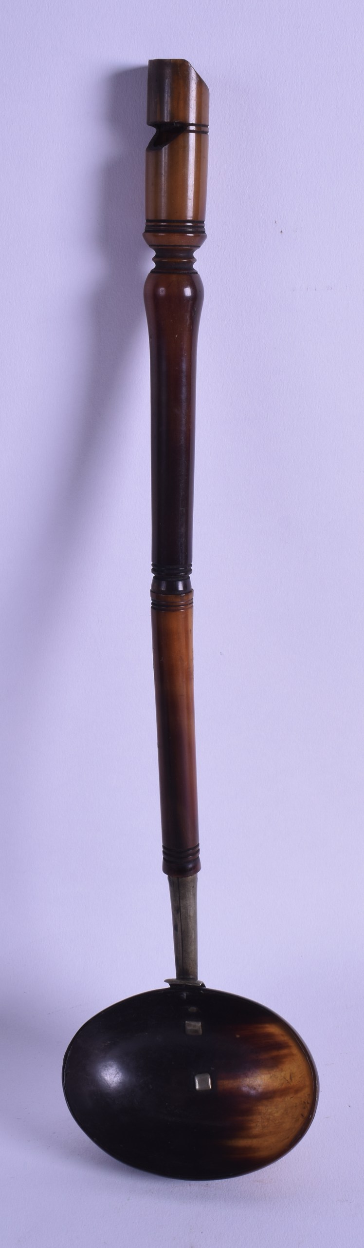 AN UNUSUAL 19TH CENTURY CARVED HORN WHISTLE LADLE with white metal mounts. 32.5 cm long.