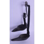 A MID 18TH CENTURY CONTINENTAL IRON HANGING OIL WICK LAMP LIGHTER with oval bowls. 25 cm long. (2)