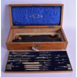 A GOOD ANTIQUE OAK CASED DRAWING INSTRUMENT SET by Stanley of London, containing numerous ivory