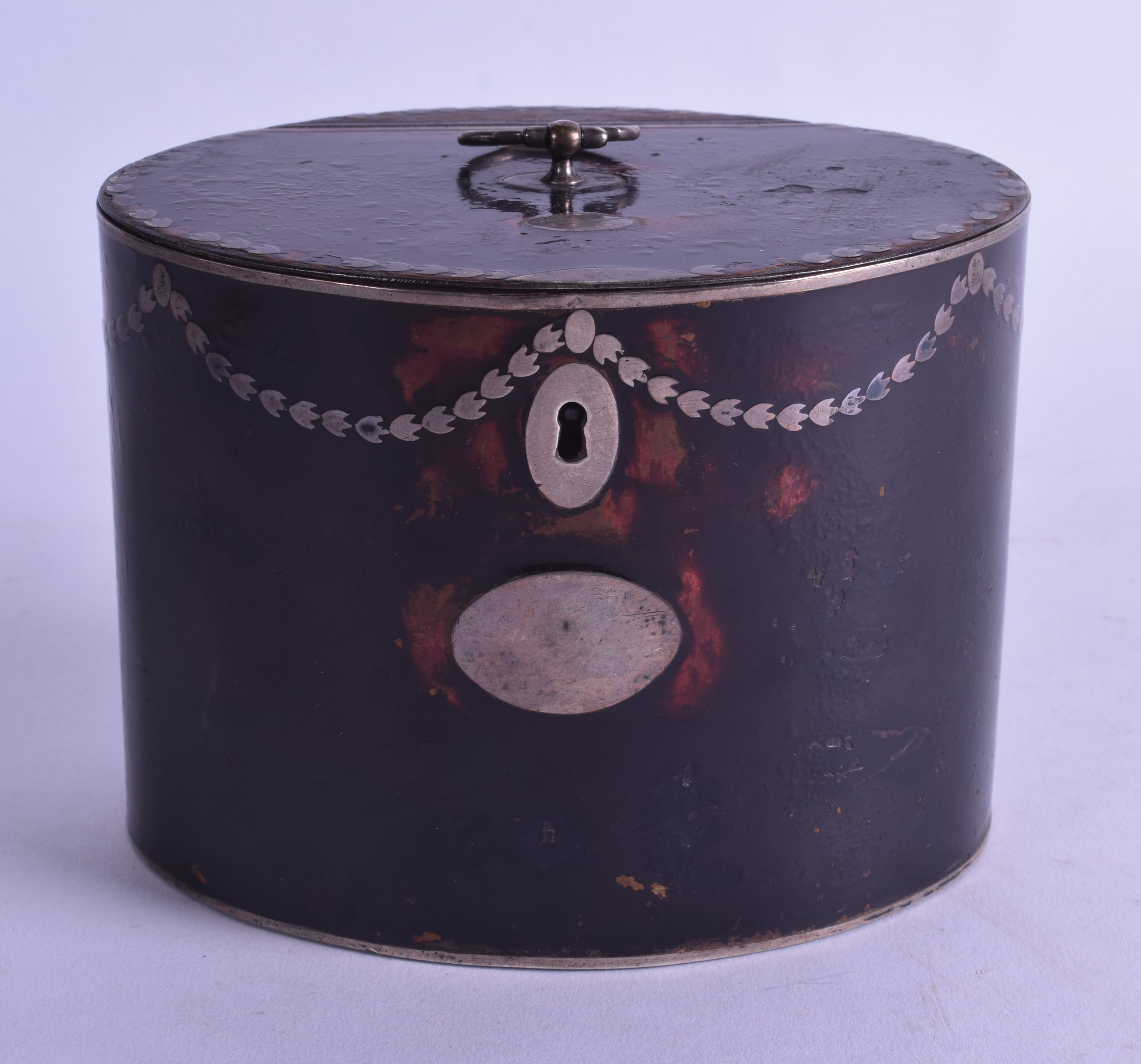 A RARE REGENCY SILVER INLAID IMITATION TORTOISESHELL TIN TEA CADDY decorated with classical vines.