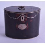 A RARE REGENCY SILVER INLAID IMITATION TORTOISESHELL TIN TEA CADDY decorated with classical vines.