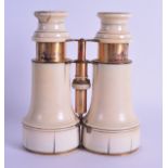 A PAIR OF 19TH CENTURY CARVED IVORY BINOCULARS by Thomas Harris & Sons. 15 cm extended.