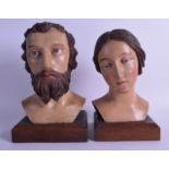 A PAIR OF 18TH CENTURY SPANISH POLYCHROMED WOOD PORTRAITS OF A MALE AND FEMALE modelled upon later