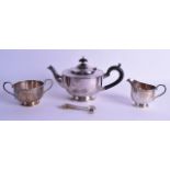 A SILVER PLATED THREE PIECE SILVER PLATED TEA SET by Harrods of London, together with a pair of