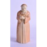 A ROYAL WORCESTER BLUSH IVORY CANDLE SNUFFER in the form of a monk. 13.5 cm high.