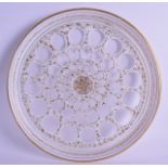 A 19TH CENTURY BOHEMIAN WHITE OVERLAID GLASS DISH highlighted in gilt with extensive vines. 27.5