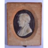 AN UNUSUAL MID 19TH CENTURY FRAMED WAX PANEL depicting a portrait of a male. Image 13 cm x 17 cm.