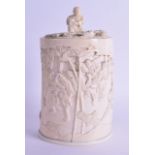 A 19TH CENTURY JAPANESE MEIJI PERIOD CARVED IVORY TUSK VASE AND COVER decorated with figures