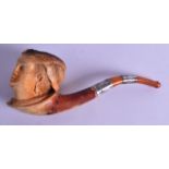 A LARGE VICTORIAN CARVED MEERSCHAUM PIPE in the form of ladies head, with white metal and amber